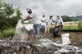 Volunteers of Indian Oil Corporation scatters bleaching powder after cleans garbage as they participates in ' Shramdaan for C