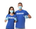 Volunteers in masks and gloves on background. Protective measures during coronavirus quarantine