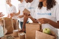 Volunteers packing food and drinks for charity Royalty Free Stock Photo