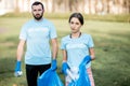 Volunteers portrait with rubbish bags in the park