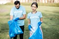 Volunteers portrait with rubbish bags in the park