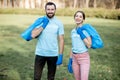 Volunteers portrait with rubbish bags in the park