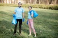 Volunteers portrait with rubbish bags in the park