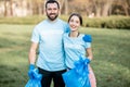 Volunteers portrait with rubbish bags in the park