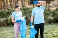 Volunteers portrait with rubbish bags in the park