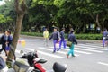 Volunteers protect student crossing the road