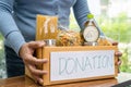 Volunteers putting various dry food in donation box for help people Royalty Free Stock Photo