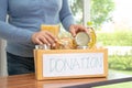 Volunteers putting various dry food in donation box for help people Royalty Free Stock Photo