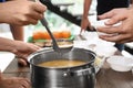 Volunteers serving food to poor people in charity centre Royalty Free Stock Photo