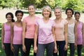 Volunteers supporting breast cancer awareness in park Royalty Free Stock Photo