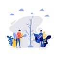 Volunteers at work. Happy young couple, man and woman planting and watering tree together. Concept of volunteering and charity Royalty Free Stock Photo