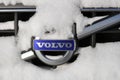 Volvo car logo on the car grill under a layer of snow Royalty Free Stock Photo
