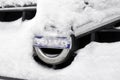 Volvo car logo on the grille under a layer of snow. Transport. Royalty Free Stock Photo