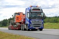 Volvo FH16 Semi Hauls Hitachi Tracked Excavator