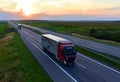 VOLVO FH Semi-trailer truck by `PRIMUM group` driving along highway on sunset background.