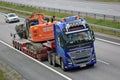 Volvo FH16 Transports Excavator on Freeway