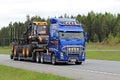 Volvo FH Transports Ponsse Forwarder along Road