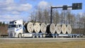 Volvo FH Truck Transports Cable Reels on Flatbed Trailer