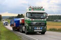 Volvo Semi Hauls Wide Load along Highway