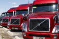 Volvo Semi Tractor Trailer Trucks Lined up for Sale. Volvo is one of the largest truck manufacturers VI Royalty Free Stock Photo