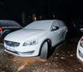 Volvo wagon car covered with snow on the street