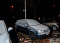 Volvo wagon car covered with snow on the street