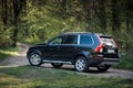 Volvo XC90 4.4 v8 1st generation restyling 4WD SUV test drive in spring forest country road side view in Grodno Belarus