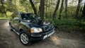 Volvo XC90 4.4 v8 1st generation restyling 4WD SUV test drive in spring forest country road wide shot side panoramic view