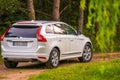 Volvo XC60 white color in green nature Royalty Free Stock Photo