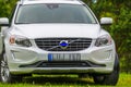 Volvo XC60 white color in green nature Royalty Free Stock Photo