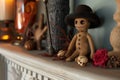 voodoo doll with a miniature hat and cane on a mantle Royalty Free Stock Photo