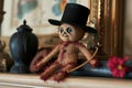 voodoo doll with a miniature hat and cane on a mantle Royalty Free Stock Photo