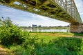 A railway bridge and the castle of Sully Sur Loire in the background.