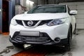 Vorkuta, Komi / Russia - 11 10 2017: Nissan Qashqai white crossover car on car wash