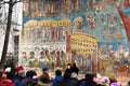 A large group of tourist visit Voronet Monastery