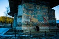 Voronet monastery and nun prayer in Suceava Royalty Free Stock Photo