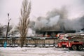 Voronezh, Russia - December 25: Fire in an industrial warehouse on Lantenskaya Street, rubber is burning, lots of smoke and flames