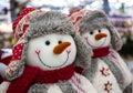 Voronezh, Russia - December 22, 2019: Toys snowmen in winter hats with earflaps and scarves