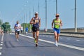 Marathon runners on city road Royalty Free Stock Photo