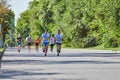 Marathon runners on city road Royalty Free Stock Photo