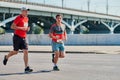 Marathon runners on city road Royalty Free Stock Photo