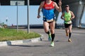 Marathon runners on city road Royalty Free Stock Photo