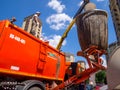 Garbage container is unloaded using a garbage truck Royalty Free Stock Photo