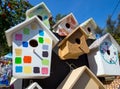 Several new birdhouses painted with paints
