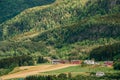 Voss, Norway. Summer Scenic Landscape With Fields And Red Farm Buildings. Traditional Norwegian Hillside Village With Royalty Free Stock Photo