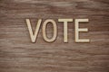 Vote Alphabet Letters on wooden background