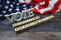 Vote Election Presidential Word alphabet letters with USA flag on wooden background