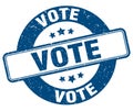 vote stamp. vote label. round grunge sign Royalty Free Stock Photo