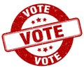 vote stamp. vote label. round grunge sign Royalty Free Stock Photo