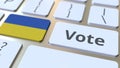 VOTE text and flag of Ukraine on the buttons on the computer keyboard. Election related conceptual 3D rendering Royalty Free Stock Photo